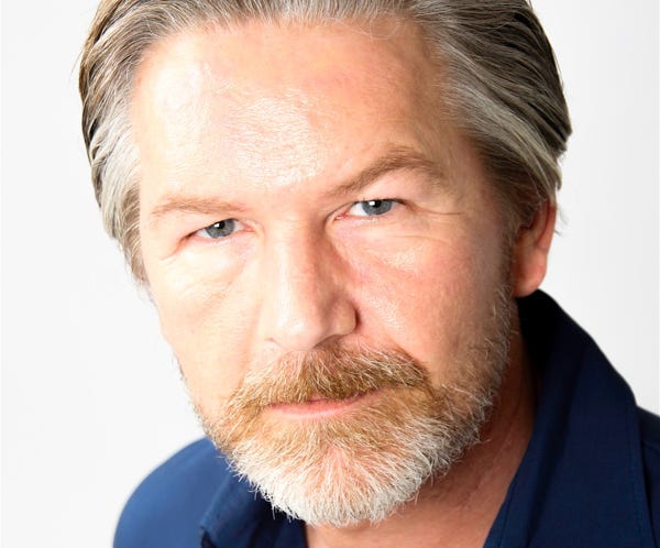 Spooky Clown Standing behind a Glass Door